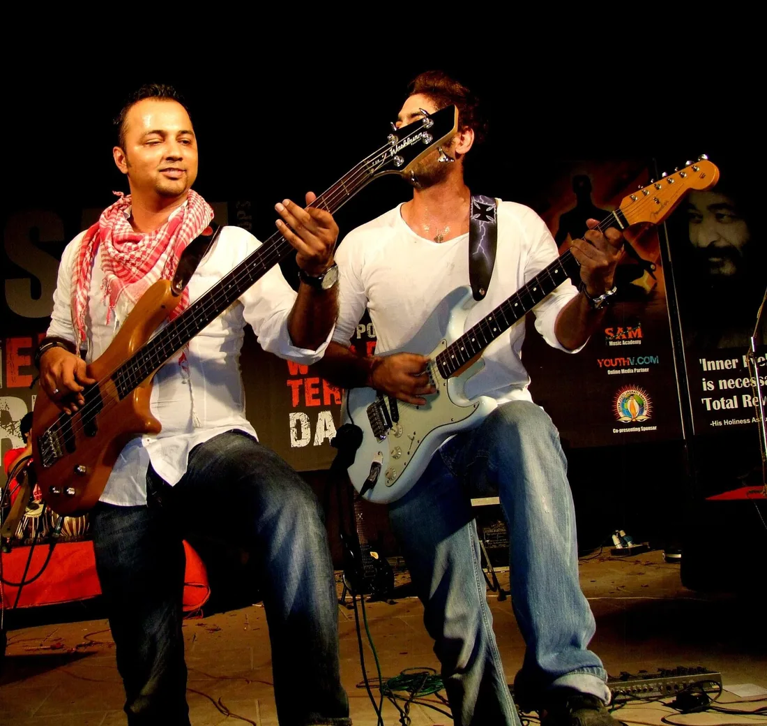 Nikhil playing bass on stage with his band